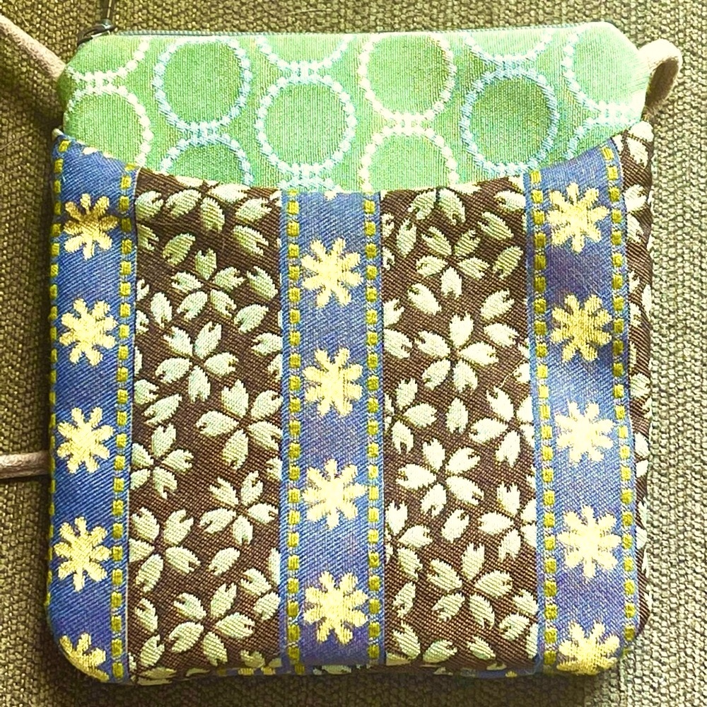 Maruca Chrysanthemum crossbody bag with 3 pockets. Only used a few times.